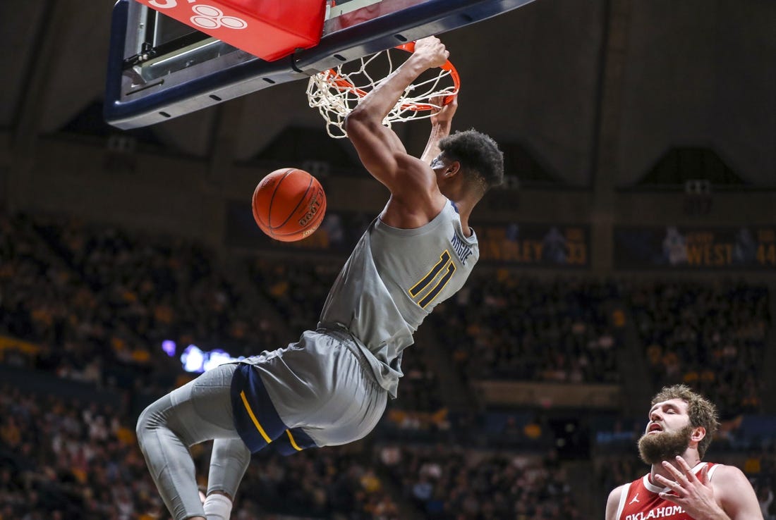 Feb 4, 2023; Morgantown, West Virginia, USA; West Virginia Mountaineers forward Mohamed Wague (11) dunks the ball during the second half against the Oklahoma Sooners at WVU Coliseum. Mandatory Credit: Ben Queen-USA TODAY Sports