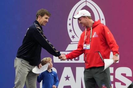 Feb 5, 2023; Paradise, Nevada, USA; NFC captain Eli Manning (left) and AFC captain Peyton Manning shake hands during the Pro Bowl Games at Allegiant Stadium. Mandatory Credit: Kirby Lee-USA TODAY Sports