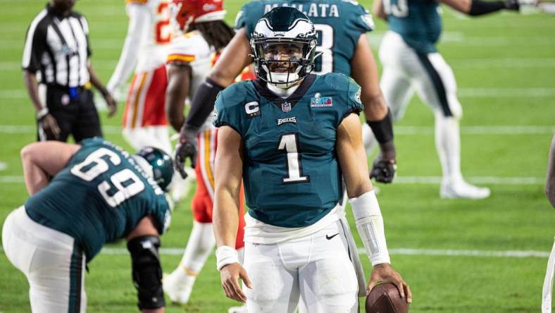 Feb 12, 2023; Glendale, Arizona, US; Philadelphia Eagles quarterback Jalen Hurts (1) reacts after scoring against the Kansas City Chiefs in Super Bowl LVII at State Farm Stadium. Mandatory Credit: Bill Streicher-USA TODAY Sports