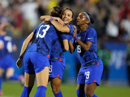 Feb 22, 2023; Frisco, Texas, USA; United States of America forward Alex Morgan (13) celebrates with forward Mallory Swanson (9) after scoring a goal against Brazil during the first half at Toyota Stadium. Mandatory Credit: Chris Jones-USA TODAY Sports
