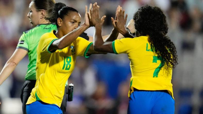 Feb 22, 2023; Frisco, Texas, USA; Brazil forward Ludmila (7) celebrates with forward Geyse (18) after scoring a goal during the second half at Toyota Stadium. Mandatory Credit: Chris Jones-USA TODAY Sports