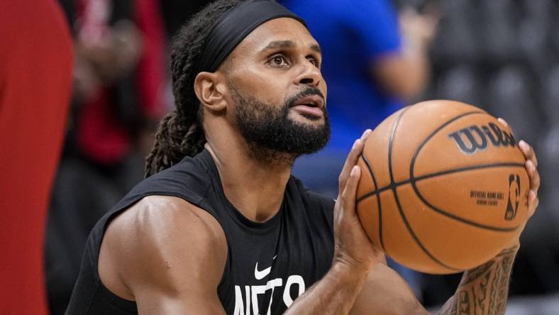 Feb 26, 2023; Atlanta, Georgia, USA; Brooklyn Nets guard Patty Mills (8) warms up on the court prior to the game against the Atlanta Hawks at State Farm Arena. Mandatory Credit: Dale Zanine-USA TODAY Sports