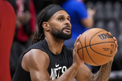 Feb 26, 2023; Atlanta, Georgia, USA; Brooklyn Nets guard Patty Mills (8) warms up on the court prior to the game against the Atlanta Hawks at State Farm Arena. Mandatory Credit: Dale Zanine-USA TODAY Sports