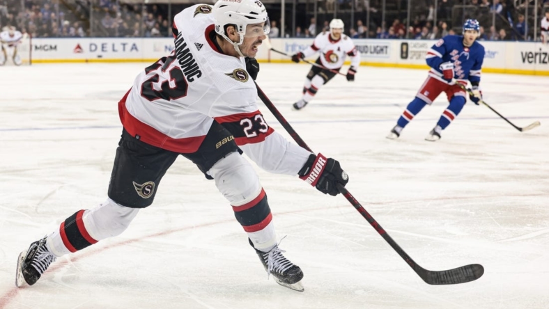 Mar 2, 2023; New York, New York, USA; Ottawa Senators defenseman Travis Hamonic (23) shoots the puck during the third period against the New York Rangers at Madison Square Garden. Mandatory Credit: Vincent Carchietta-USA TODAY Sports