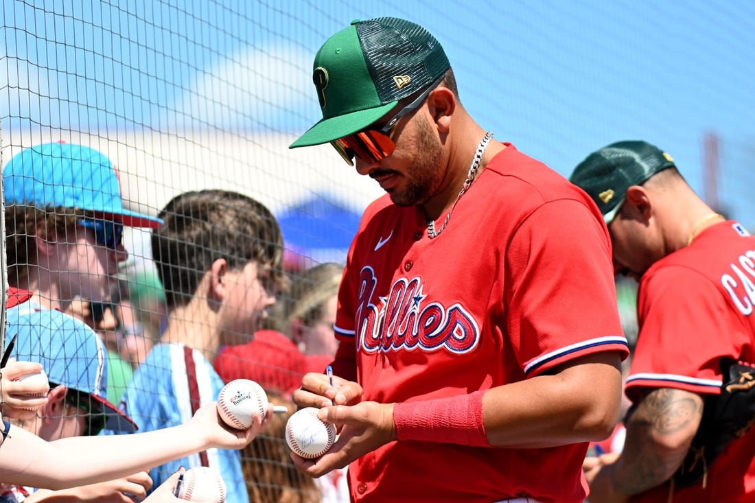 Mar 17, 2023; Clearwater, Florida, USA;  Philadelphia Phillies designated hitter Darick Hall (24) signs autographs before a spring training game against the Toronto Blue Jays at BayCare Ballpark. Mandatory Credit: Jonathan Dyer-USA TODAY Sports