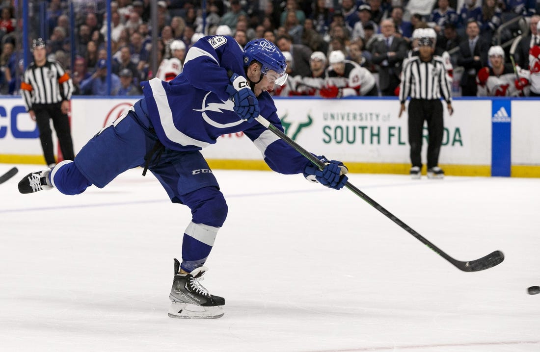 Mar 19, 2023; Tampa, Florida, USA; Tampa Bay Lightning center Ross Colton (79) takes a shot against New Jersey Devils during the first period at Amalie Arena. Mandatory Credit: Morgan Tencza-USA TODAY Sports