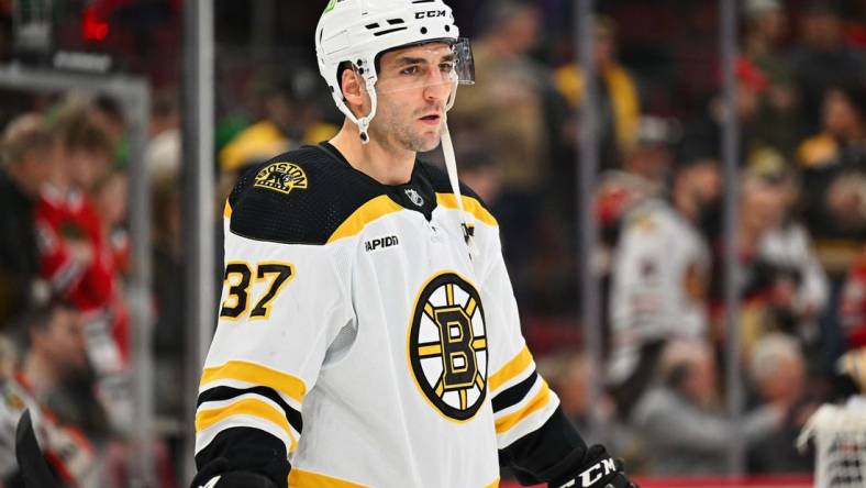 Mar 14, 2023; Chicago, Illinois, USA;  Boston Bruins forward Patrice Bergeron (37) warms up before a game against the Chicago Blackhawks at United Center. Mandatory Credit: Jamie Sabau-USA TODAY Sports