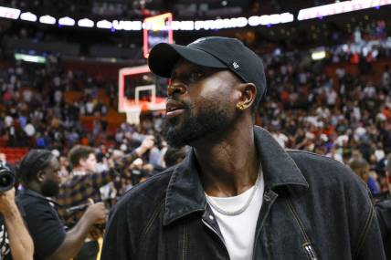 Mar 22, 2023; Miami, Florida, USA; Former Miami Heat player Dwyane Wade looks on after the game between the Miami Heat and New York Knicks at Miami-Dade Arena. Mandatory Credit: Sam Navarro-USA TODAY Sports