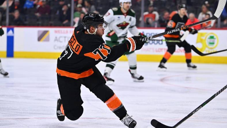 Mar 23, 2023; Philadelphia, Pennsylvania, USA; Philadelphia Flyers defenseman Tony DeAngelo (77) shoots against the Minnesota Wild in the third period at Wells Fargo Center. Mandatory Credit: Kyle Ross-USA TODAY Sports