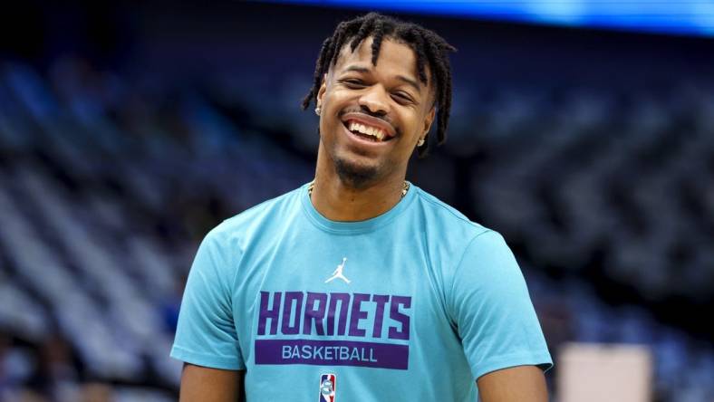 Mar 24, 2023; Dallas, Texas, USA;  Charlotte Hornets guard Dennis Smith Jr. (8) laughs before the game against the Dallas Mavericks at American Airlines Center. Mandatory Credit: Kevin Jairaj-USA TODAY Sports