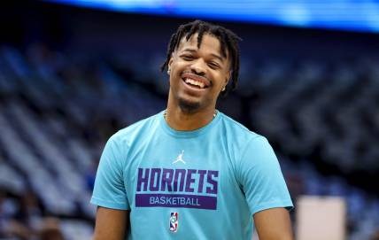 Mar 24, 2023; Dallas, Texas, USA;  Charlotte Hornets guard Dennis Smith Jr. (8) laughs before the game against the Dallas Mavericks at American Airlines Center. Mandatory Credit: Kevin Jairaj-USA TODAY Sports