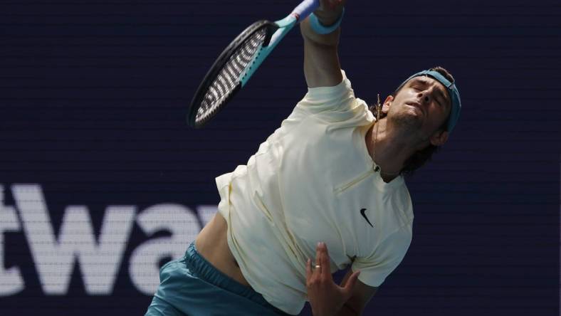 Mar 25, 2023; Miami, Florida, US; Lorenzo Musetti (ITA) serves against Jiri Lehechka (CZE) (not pictured) on day six of the Miami Open at Hard Rock Stadium. Mandatory Credit: Geoff Burke-USA TODAY Sports