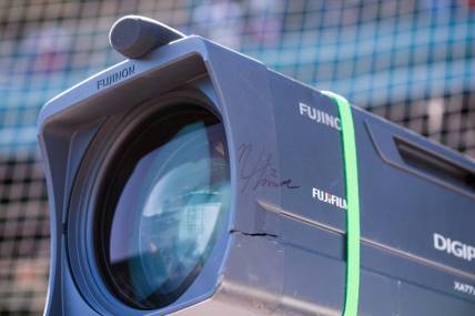 Mar 26, 2023; Mesa, Arizona, USA; A detailed view of a cracked TV camera signed by Chicago Cubs infielder Nico Hoerner (2) after a foul ball he hit hit the camera during a spring training game against the Kansas City Royals at Sloan Park. Mandatory Credit: Allan Henry-USA TODAY Sports
