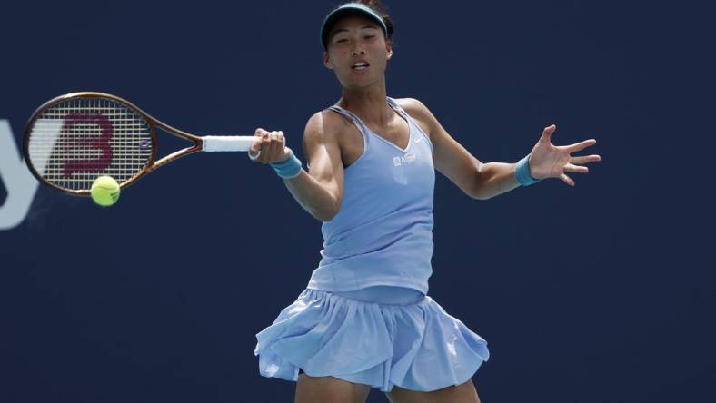 Mar 27, 2023; Miami, Florida, US; Qinwen Zheng (CHN) serves against Anastasia Potapova (not pictured) on day eight of the Miami Open at Hard Rock Stadium. Mandatory Credit: Geoff Burke-USA TODAY Sports