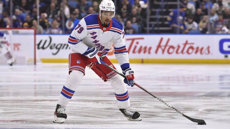 Mar 31, 2023; Buffalo, New York, USA; New York Rangers defenseman K'Andre Miller (79) handles the puck in the first period against the Buffalo Sabres at KeyBank Center. Mandatory Credit: Mark Konezny-USA TODAY Sports