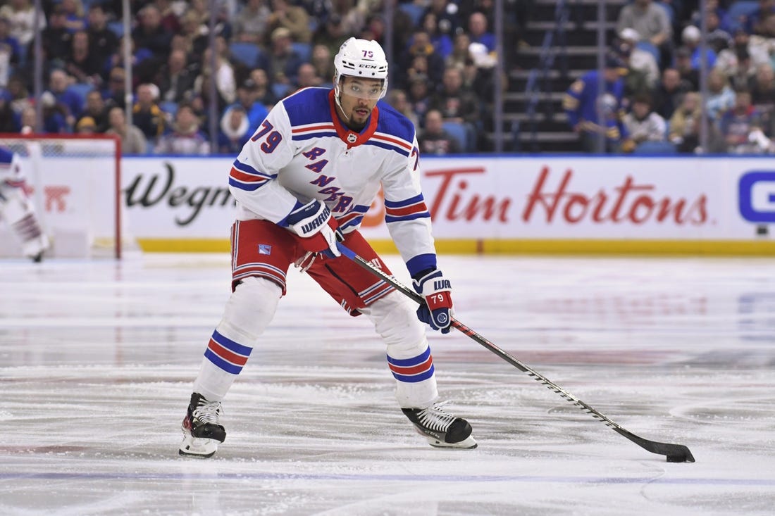 Mar 31, 2023; Buffalo, New York, USA; New York Rangers defenseman K'Andre Miller (79) handles the puck in the first period against the Buffalo Sabres at KeyBank Center. Mandatory Credit: Mark Konezny-USA TODAY Sports