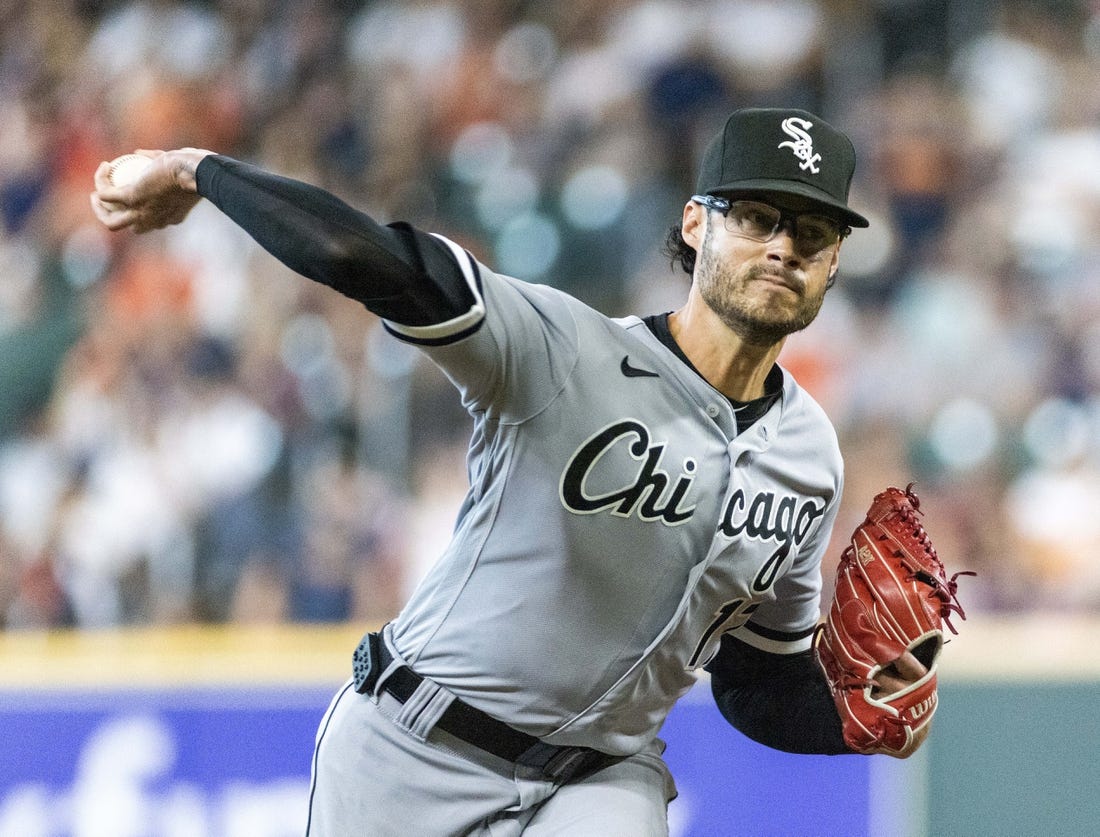 Chicago White Sox relief pitcher Bryan Shaw, right, throws out New