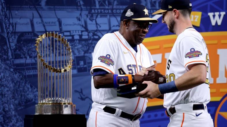 Mar 31, 2023; Houston, Texas, USA; Houston Astros manager Dusty Baker Jr. (12) celebrates with Houston Astros right fielder Kyle Tucker (30) after receiving their 2022 World Series championship rings prior to the game against the Chicago White Sox at Minute Maid Park. Mandatory Credit: Erik Williams-USA TODAY Sports