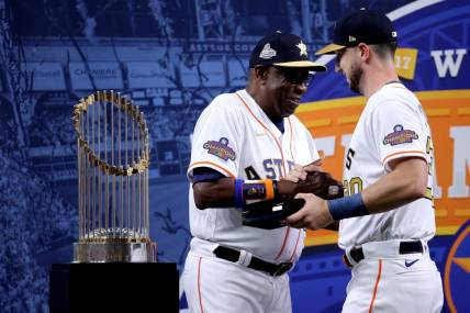 Mar 31, 2023; Houston, Texas, USA; Houston Astros manager Dusty Baker Jr. (12) celebrates with Houston Astros right fielder Kyle Tucker (30) after receiving their 2022 World Series championship rings prior to the game against the Chicago White Sox at Minute Maid Park. Mandatory Credit: Erik Williams-USA TODAY Sports