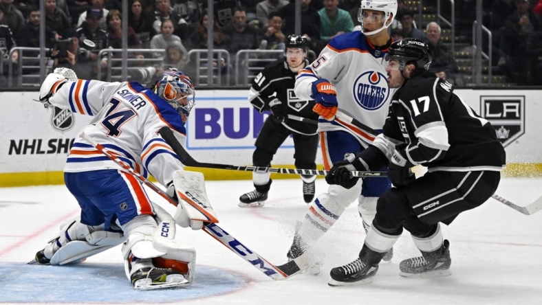 Apr 4, 2023; Los Angeles, California, USA; Edmonton Oilers goaltender Stuart Skinner (74) makes a save off a shot by Los Angeles Kings center Zack MacEwen (17) in the second period at Crypto.com Arena. Mandatory Credit: Jayne Kamin-Oncea-USA TODAY Sports
