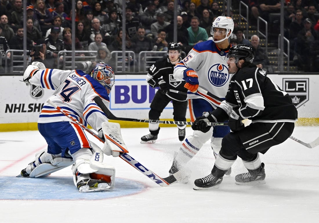 Apr 4, 2023; Los Angeles, California, USA; Edmonton Oilers goaltender Stuart Skinner (74) makes a save off a shot by Los Angeles Kings center Zack MacEwen (17) in the second period at Crypto.com Arena. Mandatory Credit: Jayne Kamin-Oncea-USA TODAY Sports