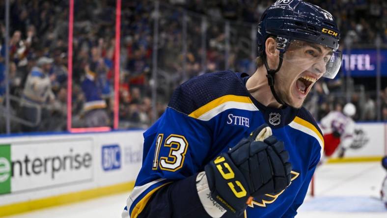 Apr 6, 2023; St. Louis, Missouri, USA;  St. Louis Blues right wing Alexey Toropchenko (13) reacts after scoring against the New York Rangers during the second period at Enterprise Center. Mandatory Credit: Jeff Curry-USA TODAY Sports