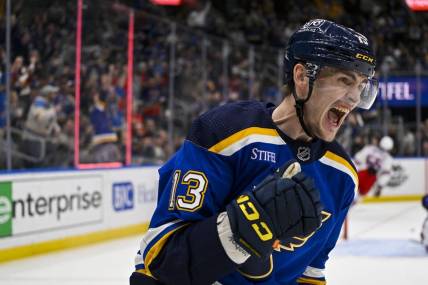 Apr 6, 2023; St. Louis, Missouri, USA;  St. Louis Blues right wing Alexey Toropchenko (13) reacts after scoring against the New York Rangers during the second period at Enterprise Center. Mandatory Credit: Jeff Curry-USA TODAY Sports