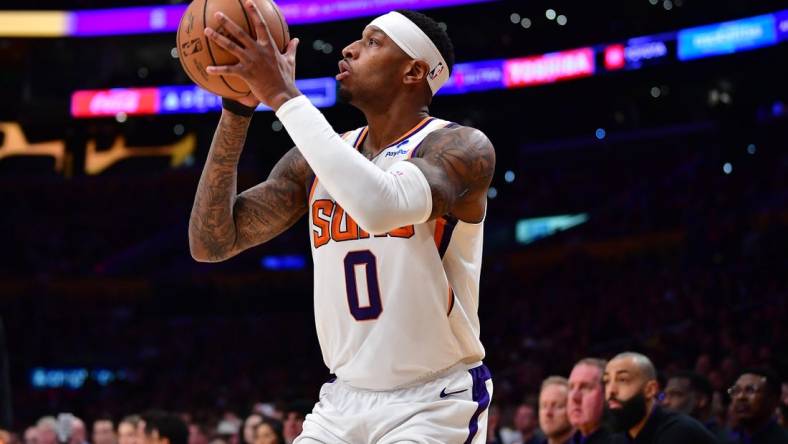 Apr 7, 2023; Los Angeles, California, USA; Phoenix Suns forward Torrey Craig (0) shoots against the Los Angeles Lakers during the second half at Crypto.com Arena. Mandatory Credit: Gary A. Vasquez-USA TODAY Sports