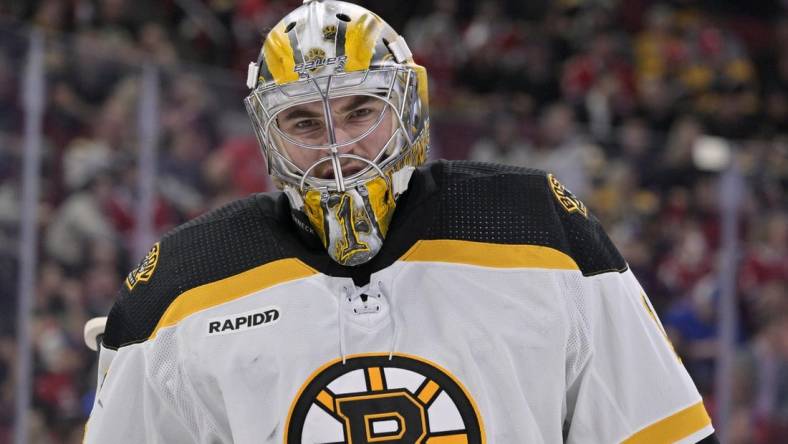 Apr 13, 2023; Montreal, Quebec, CAN; Boston Bruins goalie Jeremy Swayman (1) takes a breather during the second period of the game against the Montreal Canadiens at the Bell Centre. Mandatory Credit: Eric Bolte-USA TODAY Sports