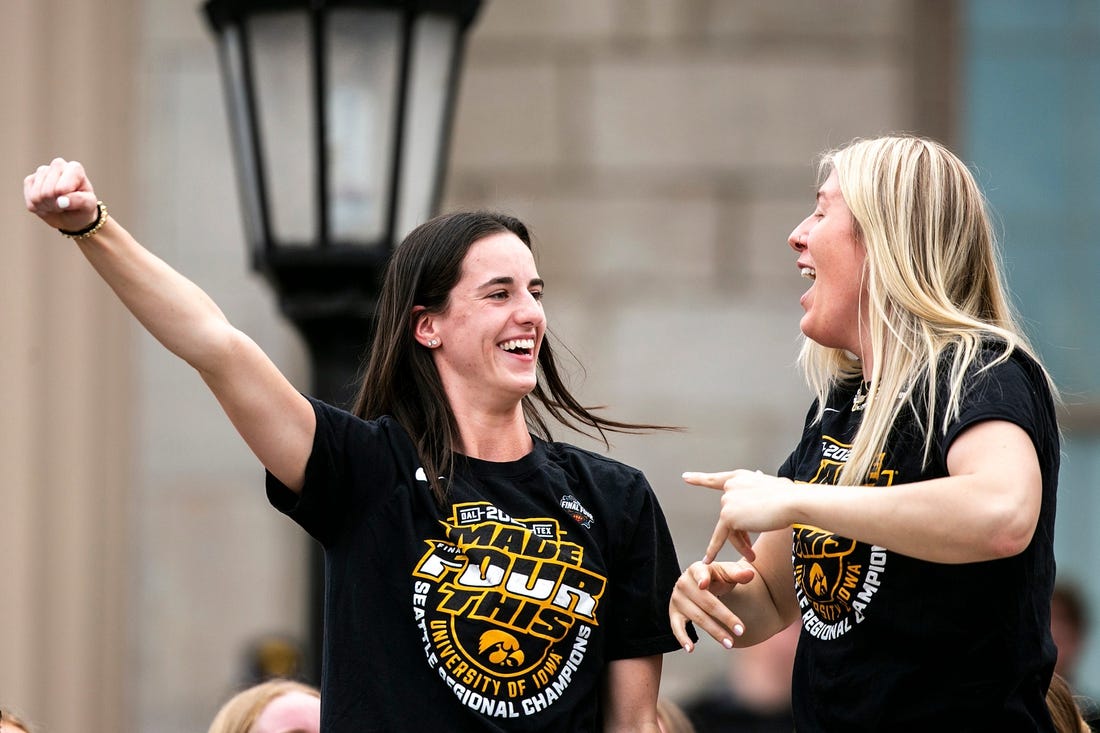 Iowa guard Caitlin Clark, left, celebrates with teammate center Monika Czinano during a ceremony honoring the women's basketball team, Friday, April 14, 2023, at the Pentacrest in Iowa City, Iowa.

230414 Iowa Wbb Ceremony 023 Jpg