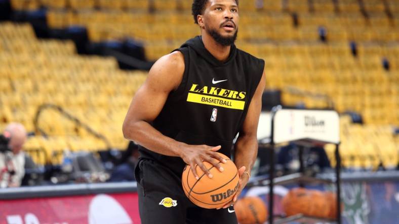 Apr 16, 2023; Memphis, Tennessee, USA; Los Angeles Lakers guard Malik Beasley (5) shoots during warm ups prior to game one of the 2023 NBA playoffs against the Memphis Grizzlies at FedExForum. Mandatory Credit: Petre Thomas-USA TODAY Sports