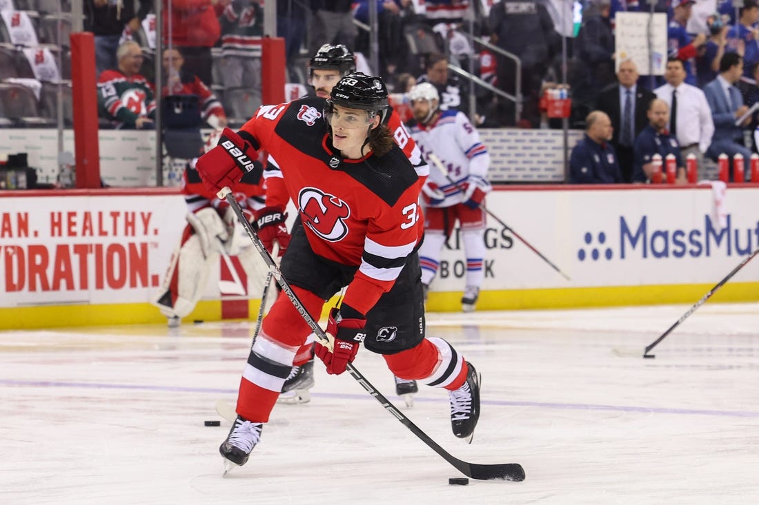 Apr 20, 2023; Newark, New Jersey, USA; New Jersey Devils defenseman Ryan Graves (33) shoots the puck during warmups against the New York Rangers before game two of the first round of the 2023 Stanley Cup Playoffs at Prudential Center. Mandatory Credit: Ed Mulholland-USA TODAY Sports