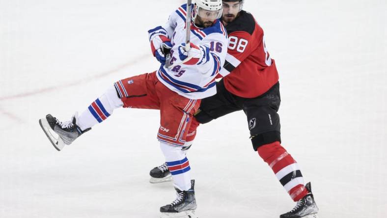 Apr 20, 2023; Newark, New Jersey, USA; New York Rangers center Vincent Trocheck (16) and New Jersey Devils defenseman Kevin Bahl (88) during the first period in game two of the first round of the 2023 Stanley Cup Playoffs at Prudential Center. Mandatory Credit: Vincent Carchietta-USA TODAY Sports