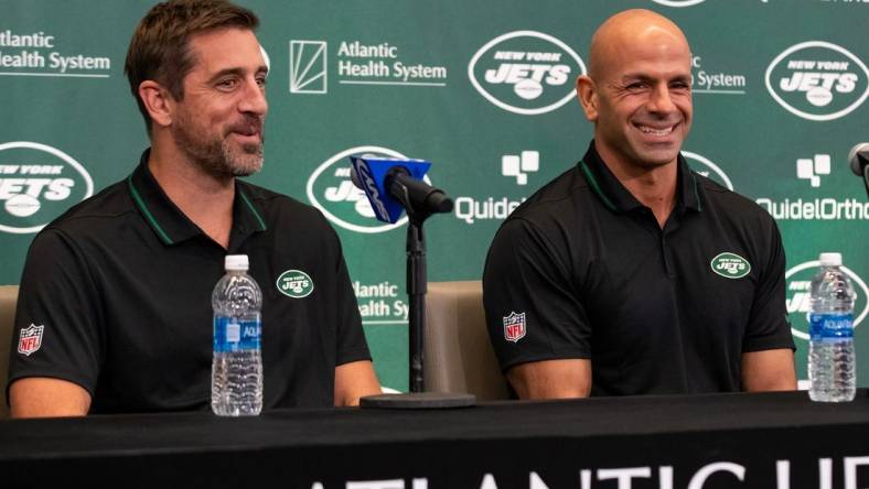 Apr 26, 2023; Florham Park, NJ, USA; New York Jets quarterback Aaron Rodgers (left) and head coach Robert Saleh (right) smile during the introductory press conference at Atlantic Health Jets Training Center. Mandatory Credit: Tom Horak-USA TODAY Sports