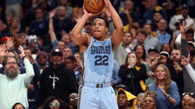 Apr 26, 2023; Memphis, Tennessee, USA; Memphis Grizzlies guard Desmond Bane (22) shoots a three point shot during the second half against the Los Angeles Lakers during game five of the 2023 NBA playoffs at FedExForum. Mandatory Credit: Petre Thomas-USA TODAY Sports