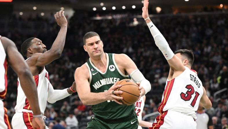 Apr 26, 2023; Milwaukee, Wisconsin, USA; Milwaukee Bucks center Brook Lopez (11) drives against Miami Heat during game five of the 2023 NBA Playoffs at Fiserv Forum. Mandatory Credit: Michael McLoone-USA TODAY Sports