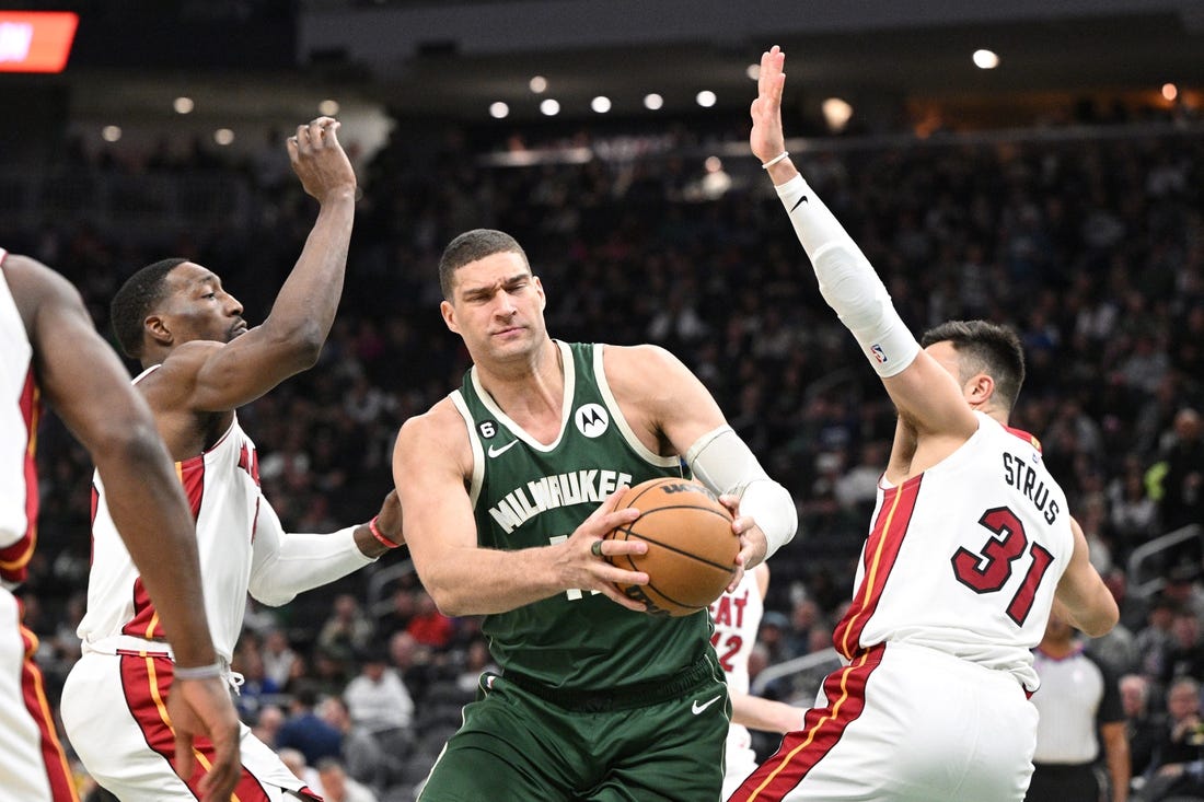 Apr 26, 2023; Milwaukee, Wisconsin, USA; Milwaukee Bucks center Brook Lopez (11) drives against Miami Heat during game five of the 2023 NBA Playoffs at Fiserv Forum. Mandatory Credit: Michael McLoone-USA TODAY Sports