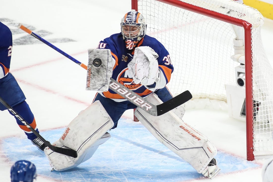 Apr 28, 2023; Elmont, New York, USA; New York Islanders goaltender Ilya Sorokin (30) stops the puck in game six of the first round of the 2023 Stanley Cup Playoffs against the Carolina Hurricanes at UBS Arena. Mandatory Credit: Wendell Cruz-USA TODAY Sports