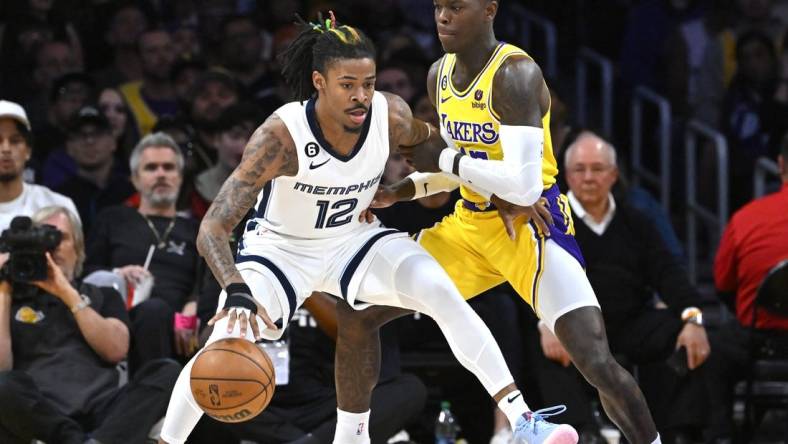Apr 28, 2023; Los Angeles, California, USA; Los Angeles Lakers guard Dennis Schroder (17) defends Memphis Grizzlies guard Ja Morant (12) in the first half of game six of the 2023 NBA playoffs at Crypto.com Arena. Mandatory Credit: Jayne Kamin-Oncea-USA TODAY Sports