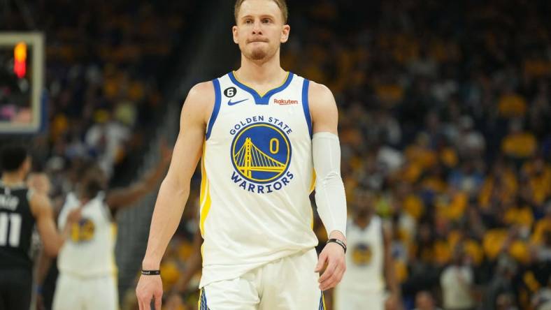 Apr 23, 2023; San Francisco, California, USA; Golden State Warriors guard Donte DiVincenzo (0) during the second quarter of game four of the 2023 NBA playoffs against the Sacramento Kings at Chase Center. Mandatory Credit: Darren Yamashita-USA TODAY Sports