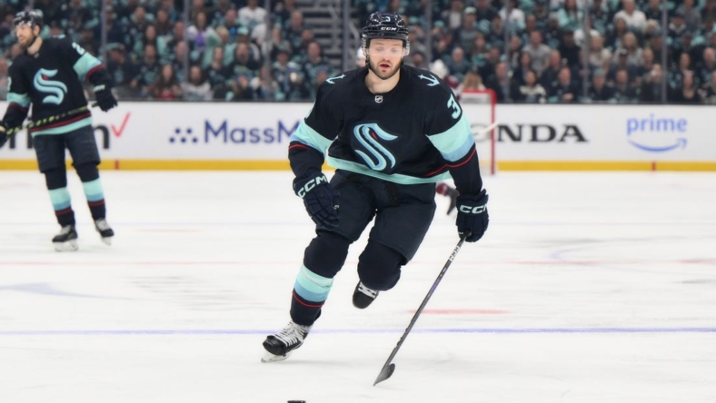 Apr 28, 2023; Seattle, Washington, USA; Seattle Kraken defenseman Will Borgen (3) advances the puck in game six of the first round of the 2023 Stanely Cup Playoffs at Climate Pledge Arena. Mandatory Credit: Steven Bisig-USA TODAY Sports