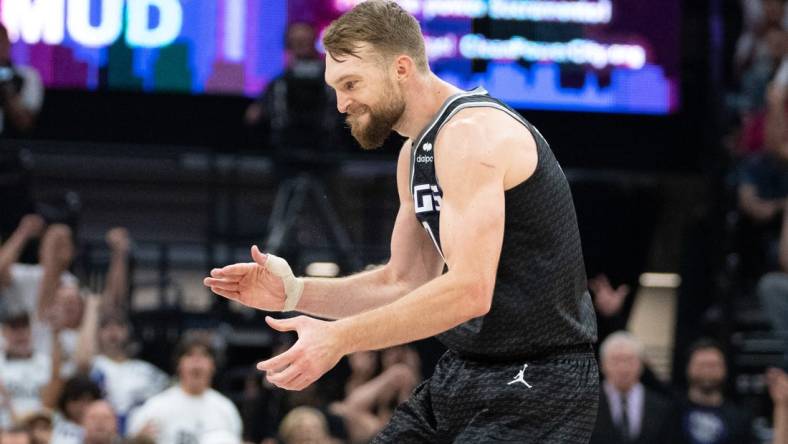 April 30, 2023; Sacramento, California, USA; Sacramento Kings forward Domantas Sabonis (10) celebrates against the Golden State Warriors during the second quarter in game seven of the 2023 NBA playoffs first round at Golden 1 Center. Mandatory Credit: Kyle Terada-USA TODAY Sports