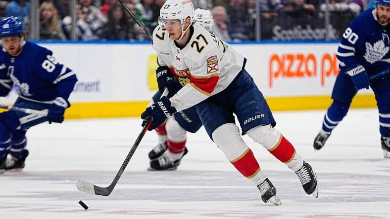 May 4, 2023; Toronto, Ontario, CANADA; Florida Panthers forward Eetu Luostarinen (27) carries the puck against the Toronto Maple Leafs during game two of the second round of the 2023 Stanley Cup Playoffs at Scotiabank Arena. Mandatory Credit: John E. Sokolowski-USA TODAY Sports