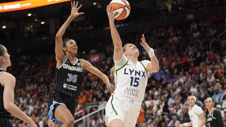 May 13, 2023; Toronto, Ontario, Canada; Minnesota Lynx guard Rachel Banham (15) goes up to make a basket as Chicago Sky guard Rebekah Gardner (35) pursues during the second half at Scotiabank Arena. Mandatory Credit: John E. Sokolowski-USA TODAY Sports