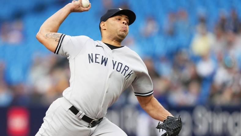 May 15, 2023; Toronto, Ontario, CAN; New York Yankees starting pitcher Jimmy Cordero (70) throws a pitch against the Toronto Blue Jays during the first inning at Rogers Centre. Mandatory Credit: Nick Turchiaro-USA TODAY Sports