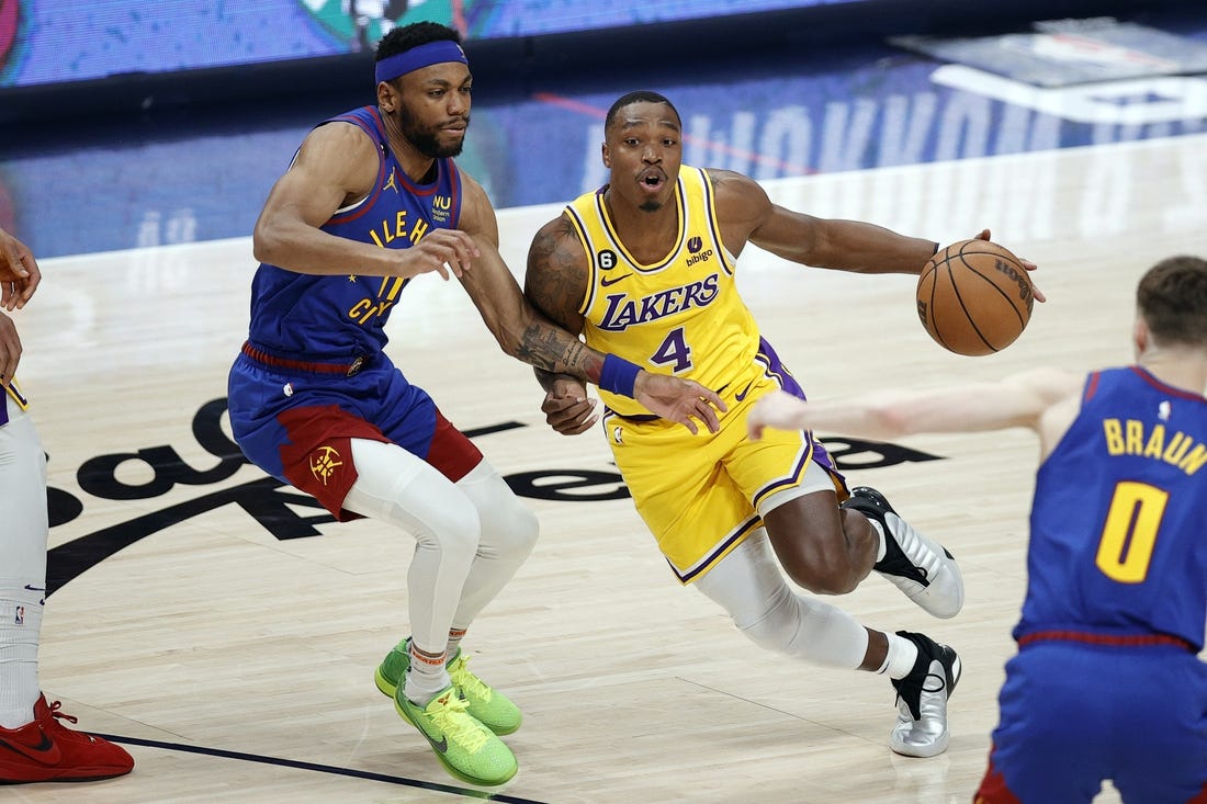 May 16, 2023; Denver, Colorado, USA; Los Angeles Lakers guard Lonnie Walker IV (4) controls the ball against Denver Nuggets forward Bruce Brown (11) in the second half during game one of the Western Conference Finals for the 2023 NBA playoffs at Ball Arena. Mandatory Credit: Isaiah J. Downing-USA TODAY Sports