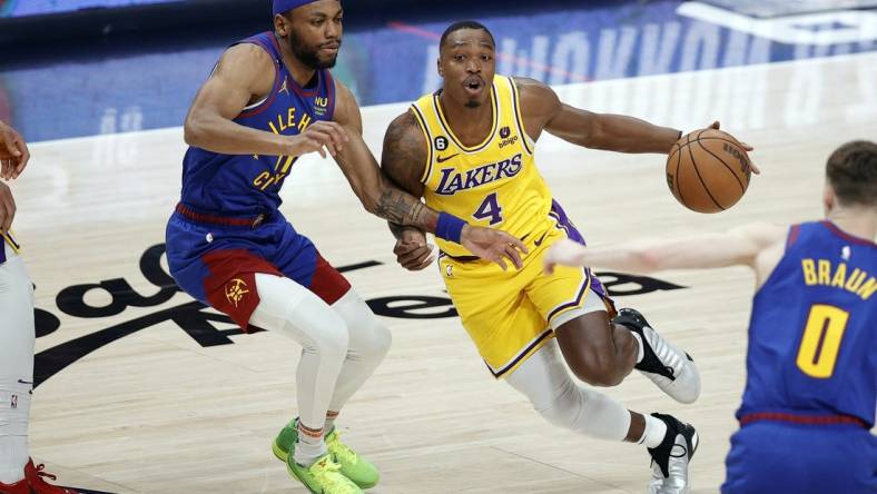 May 16, 2023; Denver, Colorado, USA; Los Angeles Lakers guard Lonnie Walker IV (4) controls the ball against Denver Nuggets forward Bruce Brown (11) in the second half during game one of the Western Conference Finals for the 2023 NBA playoffs at Ball Arena. Mandatory Credit: Isaiah J. Downing-USA TODAY Sports