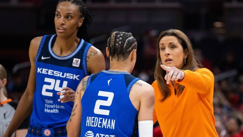 May 19, 2023; Indianapolis, Indiana, USA; Connecticut Sun head coach Stephanie White talks with guard Natisha Hiedeman (2) in the first half against the Indiana Fever at Gainbridge Fieldhouse. Mandatory Credit: Trevor Ruszkowski-USA TODAY Sports