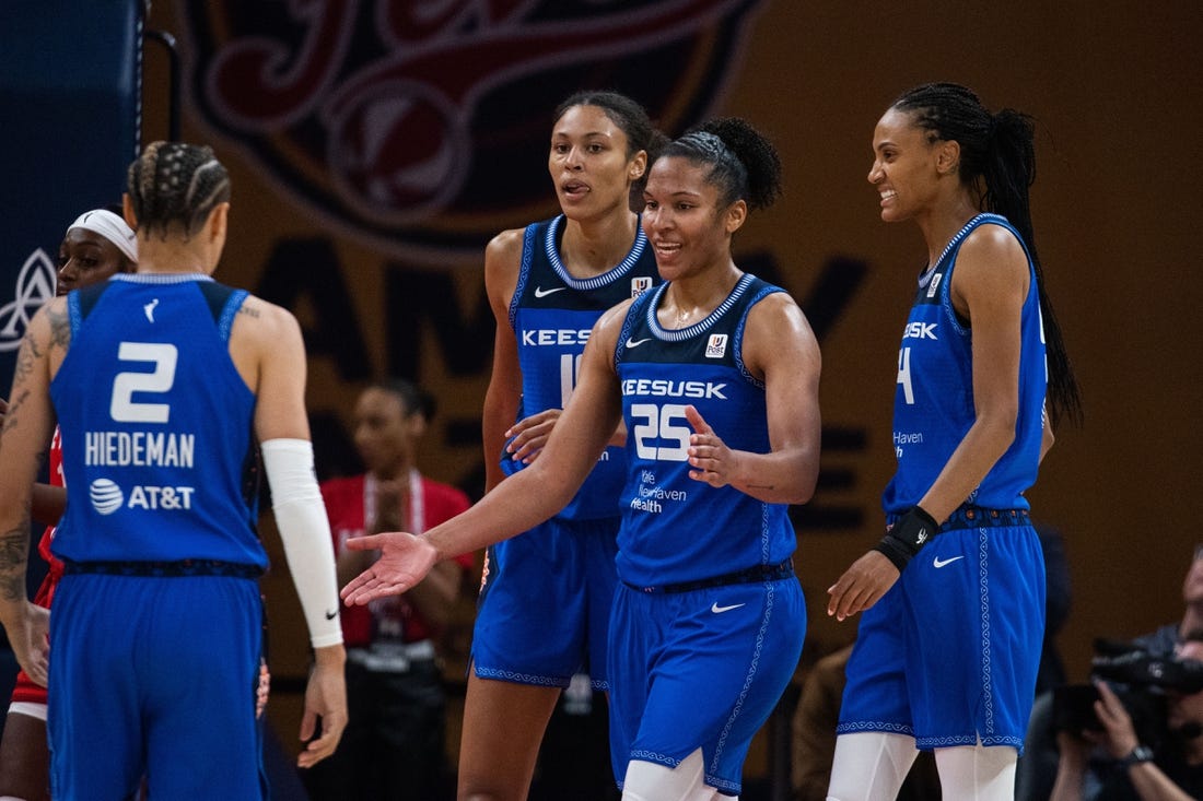 May 19, 2023; Indianapolis, Indiana, USA; Connecticut Sun forward Alyssa Thomas (25) celebrates a and one with teammates in the second half against the Indiana Fever at Gainbridge Fieldhouse. Mandatory Credit: Trevor Ruszkowski-USA TODAY Sports
