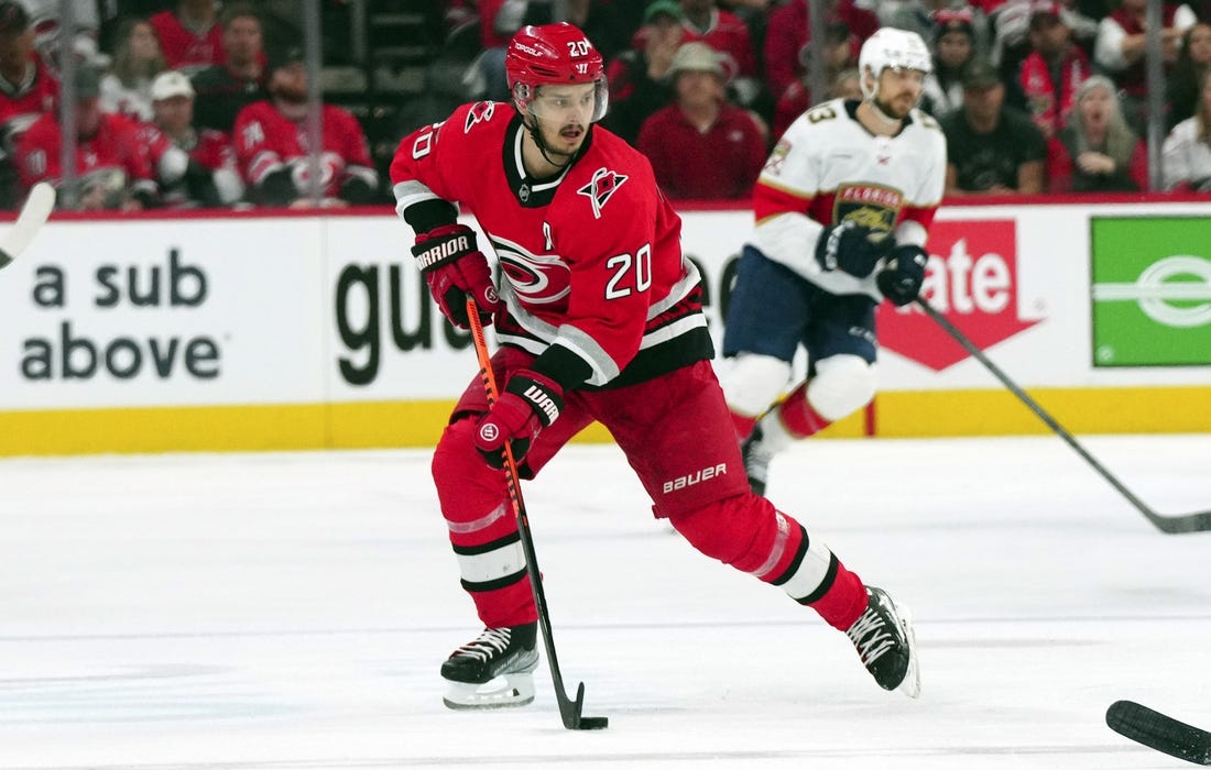 May 20, 2023; Raleigh, North Carolina, USA; Carolina Hurricanes center Sebastian Aho (20) pushes the puck up the ice against the Florida Panthers in game two of the Eastern Conference Finals of the 2023 Stanley Cup Playoffs at PNC Arena. Mandatory Credit: James Guillory-USA TODAY Sports